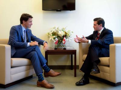 Canadian Prime Minister Justin Trudeau and Mexican President Enrique Peña Nieto chatting on the sidelines of the U.N. General Assembly this week. No meeting occurred between Mr. Trudeau and President Trump amid stark trade differences. PHOTO: HANDOUT/REUTERS
